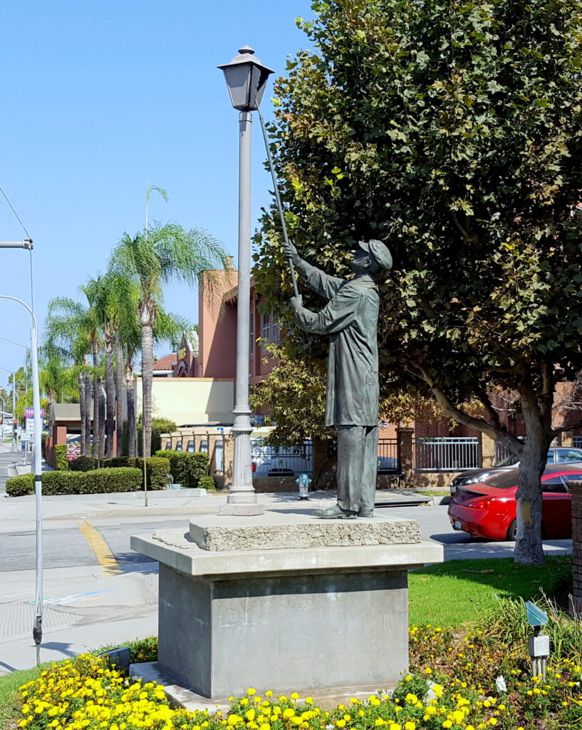 The Lamplighter, Robert Steinkamp, Northeast Corner of Imperial & Orange